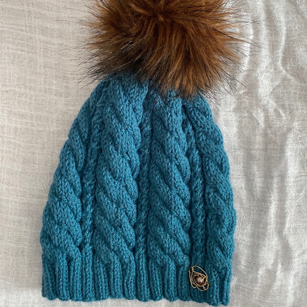 Handmade cable knit beanie with faux fur